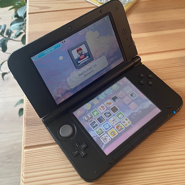 my old modded 3DS with a bunch of apps and games on the homescreen